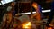Group of workers pouring molten metal in mold at workshop 4k