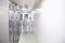 Group of workers in protective clothing in a sterile room of a f