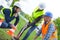 Group workers with shovels digging trench