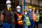 Group of workers or technician with mask stand and look right side direction and stay in factory area