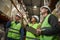 Group of workers in warehouse doing stock review storage management