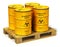 Group of yellow drums with radioactive waste on shipping pallet