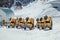 Group of yellow snow cannons are waiting for the start of the ski season in the mountains