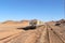 Group of yellow wagons with material for nitrogen fertilizers in desert