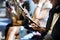 Group of young adult friends using smartphones in the subway