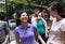 Group of young adults walking and talking in city