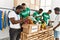 Group of young african american volunteers working at charity center