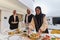 Group of young Arab women come together to lovingly prepare an iftar table during the sacred Muslim month of Ramadan