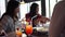 Group of young Asian women eating and talking at cafe and restaurant