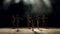 A group of young ballerina girls dancing on stage in the dark, close-up.Slow mo.