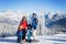 Group of young beautiful people, adults and kids, skiing