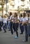 Group of young boys and girls standing in the middle of the street preparing for show