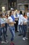 Group of young boys and girls standing in the middle of the street preparing for show