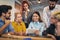 Group of young business people in smart casual wear working together