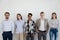 Group of young business people standing looking at camera