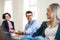 Group of young businesspeople working together in a modern office.