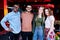 Group of young cheerful intercultural friends standing in bowling room