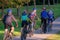 A group of young cyclists in training. One of them turned towards the camera