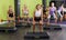 Group of young females training with barbell workout