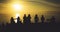 Group of young friends on background beach ocean sunrise, silhouette romantic people dances looking on rear view evening seascape