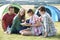 Group Of Young Friends Camping In Countryside Reading Map