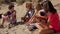 Group of young friends chilling out at the seaside