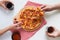 Group of young friends tasting pizza and drinking soft drink on