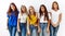 Group of young girl friends standing together over isolated background looking sleepy and tired, exhausted for fatigue and