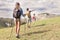 Group of young hikers in the mountain in single file