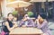 Group of young hipster sitting in a cafe,Young cheerful friends having fun while take time together, Holiday freedom enjoy