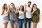 Group of young hispanic friends standing together over isolated background waiving saying hello happy and smiling, friendly