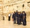 A group of young Israelis in police uniform are doing a picture in memory of the visit to the Wailing Wall