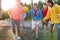 Group of young male teenagers playing basketball outdoors