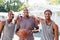 Group Of Young Men Playing Basketball Match