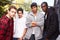 Group Of Young Men In Urban Setting Standing By Fe