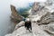 Group of young mountain climbers on a steep Via Ferrata with a grandiose view of the Italian Dolomites