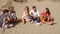 Group of young multiracial friends playing guitar