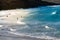 Group of young people at beach going surfing