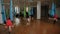 Group of young people doing stretching. Aerial yoga exercise or antigravity yoga