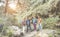 Group of young people doing trekking excursion in mountain`s path - Hikers walking in nature outdoor - Survival,travel and