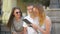 Group of Young People with Notes, Pens and Tablet Spending Time Outside. Outdoors Portrait of Three Students Talking and