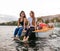 Group of young people on a pedalo boat