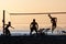 Group of young people playing footvolley on the beach