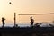 Group of young people playing footvolley on the beach