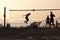 Group of young people playing footvolley on the beach