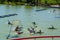 Group of young people playing kayak polo in a pond in a park in Madrid, Spain. Europe.