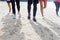 Group Of Young People Running On Beach Feet Closeup Sport Runners Jogging Working Out Team Training Together