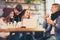 Group of young people sitting in a coffee shop