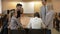 Group of young people sitting at a table solve a problem.