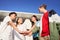 Group of young people stacking hands celebrating successes. Portrait of multiethnic students laughing in the